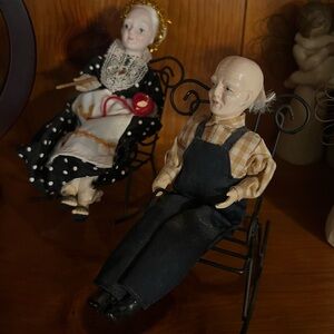 Antique porcelain couple rocking in chairs